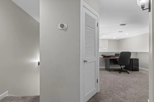 a view of a workspace with furniture