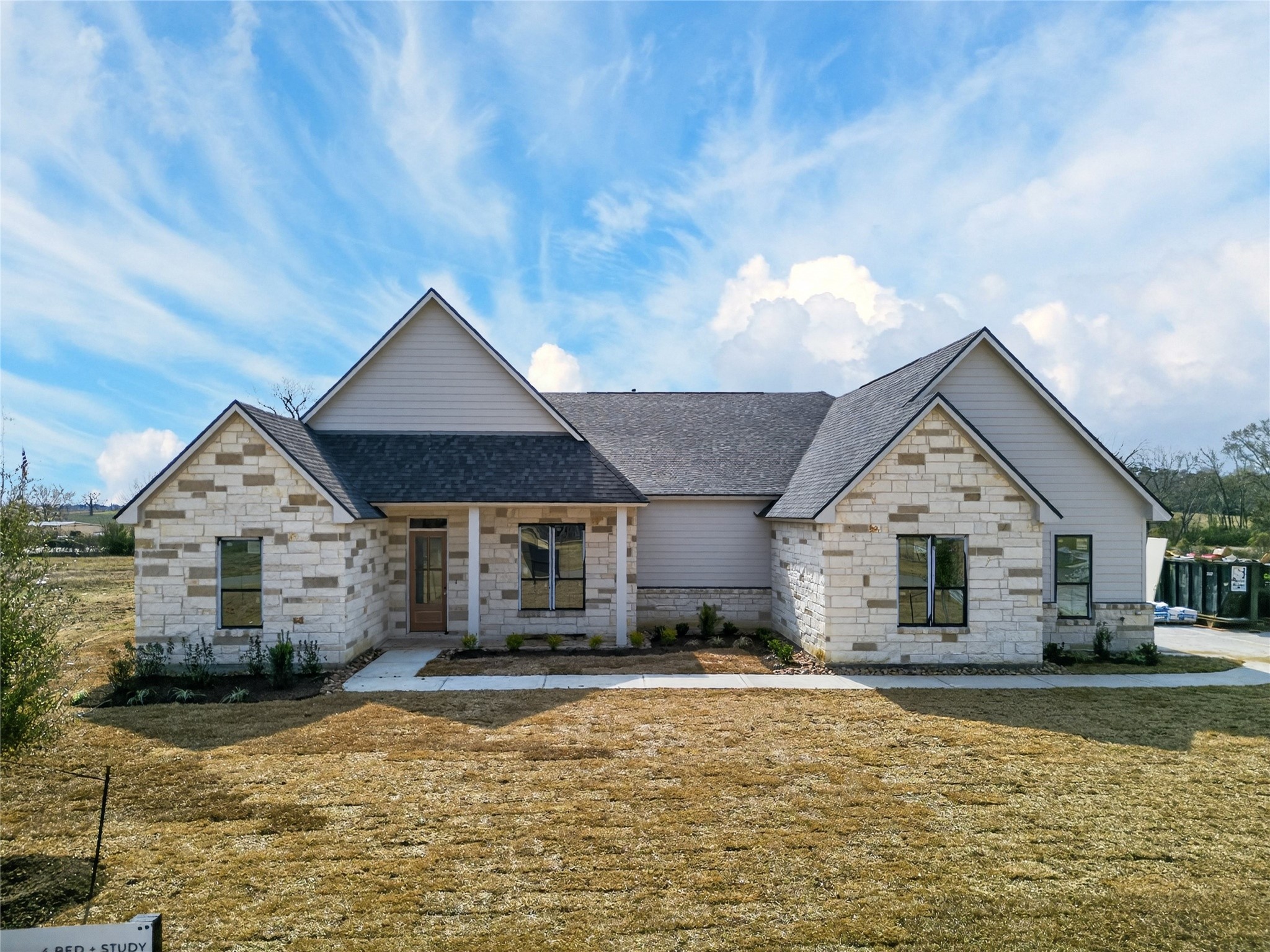 24921 Hopeview Way Montgomery, TX 77356 - Photo 2 of 13 a front view of a house with a yard