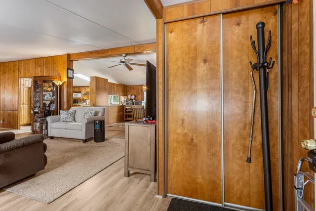 a en suite bathroom with a shower curtain and a large mirror