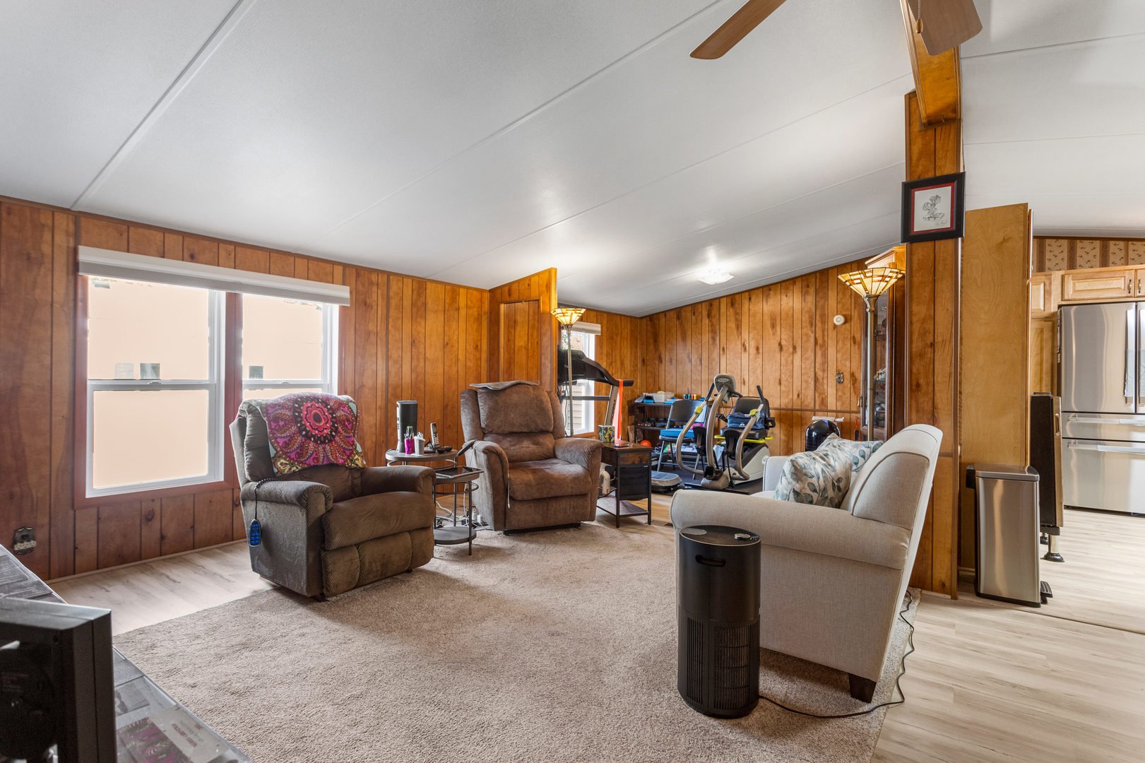 628 Williamson Street Mahomet, IL 61853 - Photo 14 of 36 a living room with furniture floor to ceiling window and a flat screen tv