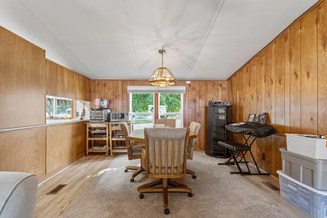 a view of a dining room with furniture window and outside view