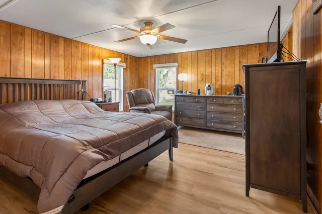 a bed room with a bed and a window