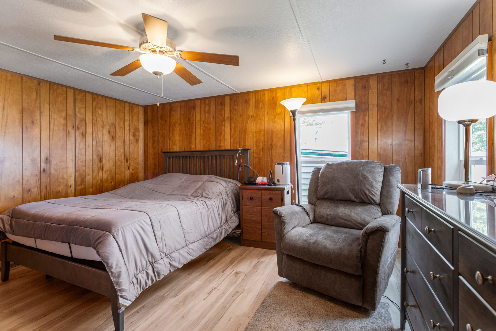 628 Williamson Street Mahomet, IL 61853 - Photo 25 of 36 a spacious bedroom with a bed and a chandelier