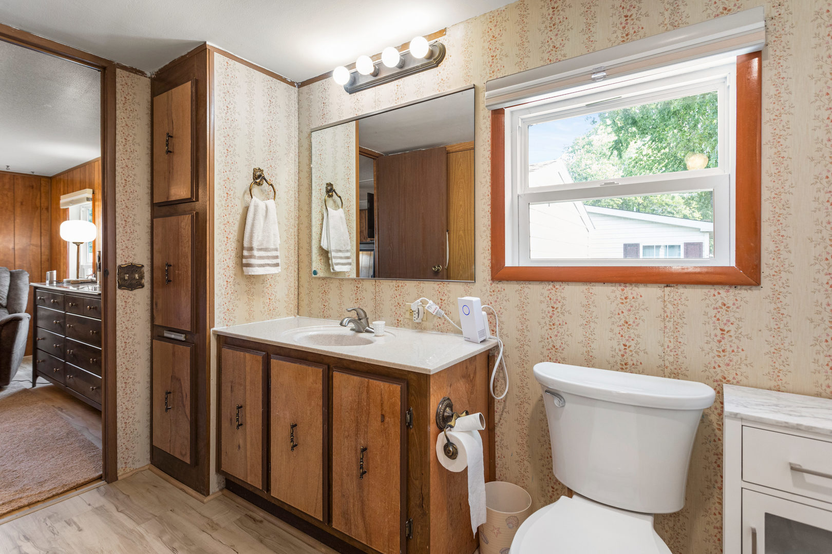 628 Williamson Street Mahomet, IL 61853 - Photo 27 of 36 a bathroom with a toilet a sink and a mirror