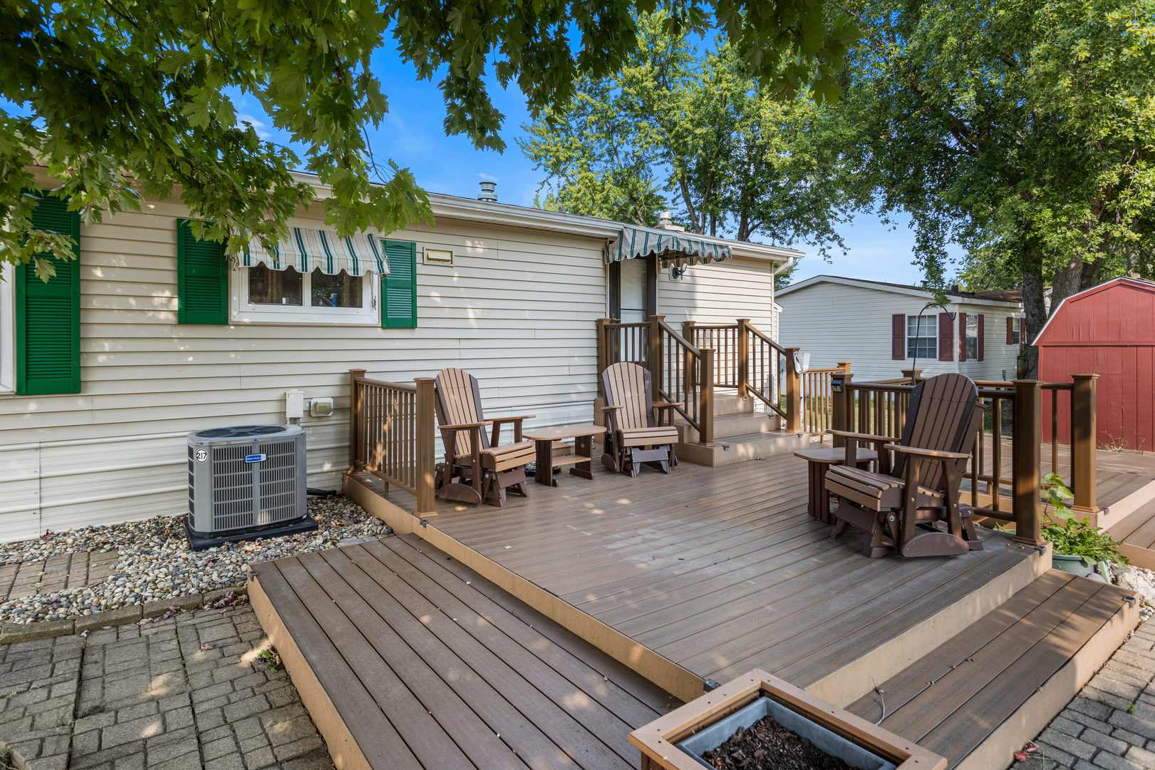 628 Williamson Street Mahomet, IL 61853 - Photo 3 of 36 a view of a deck with table and chairs and wooden floor