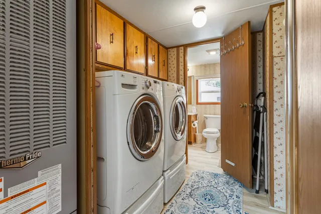 a view of a hallway with washer and dryer