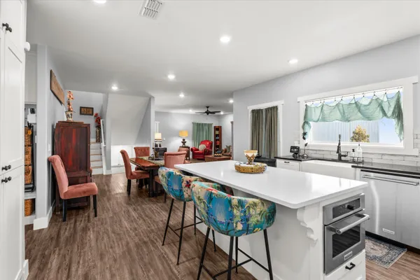 a large kitchen with a table and chairs