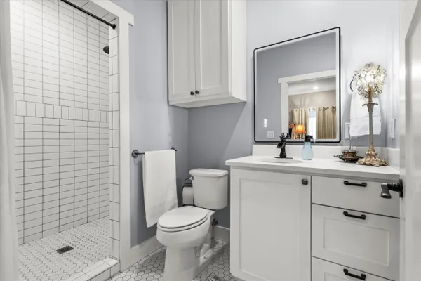 a view of a bedroom with washer and dryer