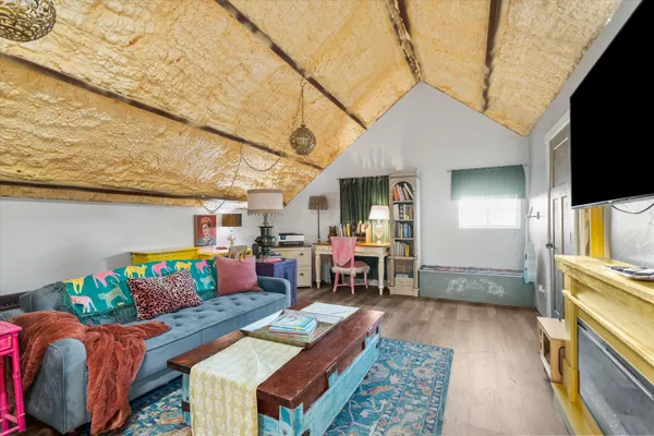 a front view of a house with swimming pool and seating space