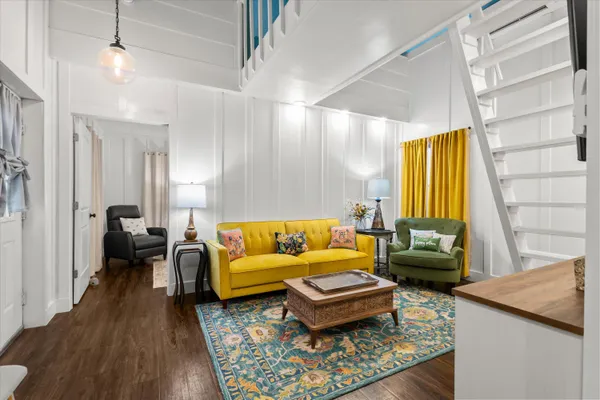 a spacious bathroom with a granite countertop sink mirror and a bathtub