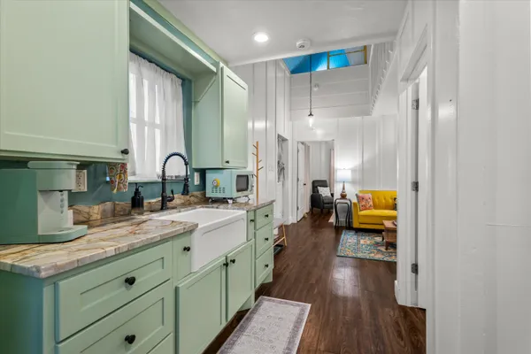 a bedroom with bed and a walk in closet