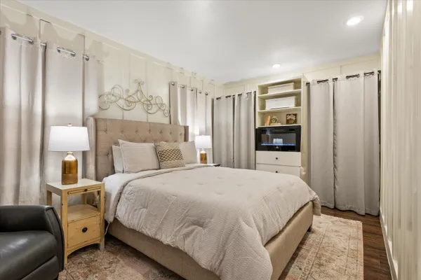 a view of a house with wooden fence