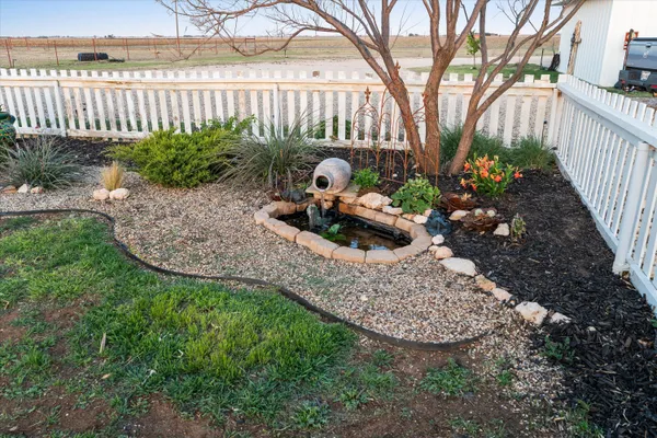 a storage room with water heater and racks