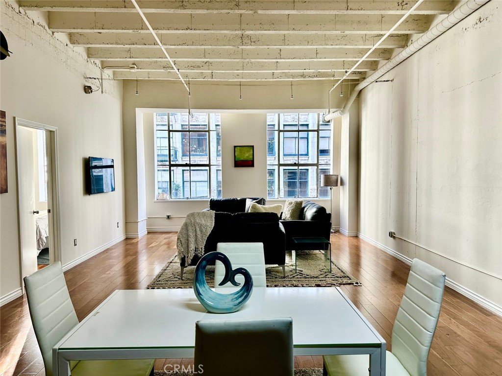 a dining room with furniture and window