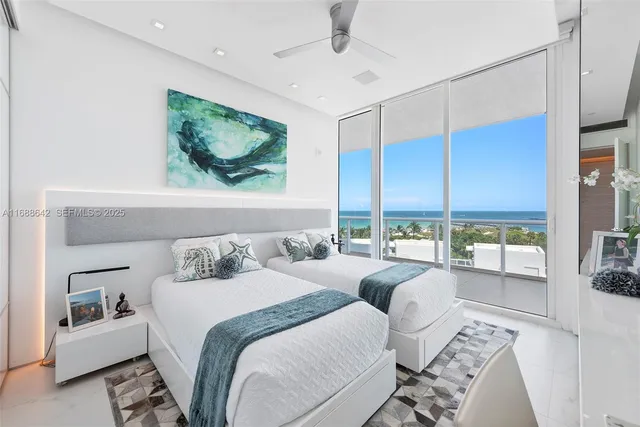 a bedroom with a large bed and a flat screen tv