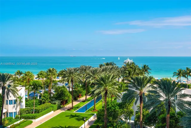 a view of a yard with an ocean view