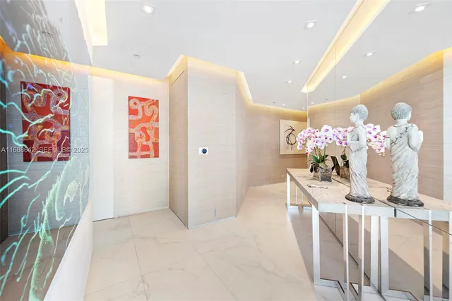 a dining room with furniture and chandelier
