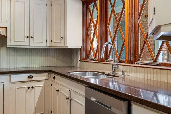 a bathroom with a sink vanity and a mirror