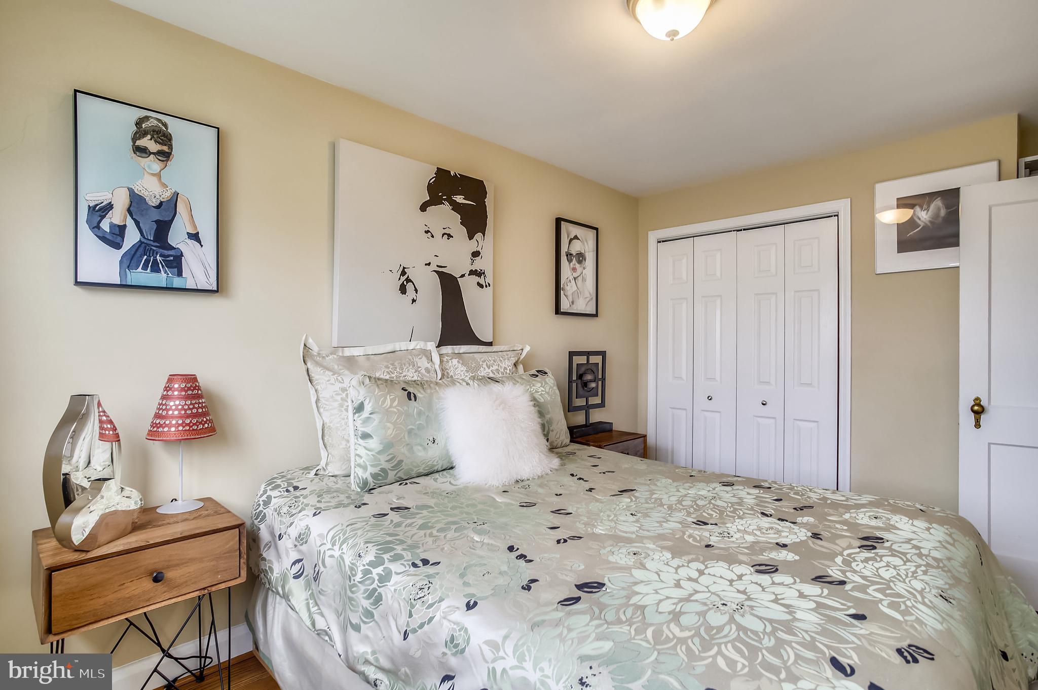 1409 Langford Road Baltimore, MD 21207 - Photo 26 of 39 a bedroom with a bed and wooden floor
