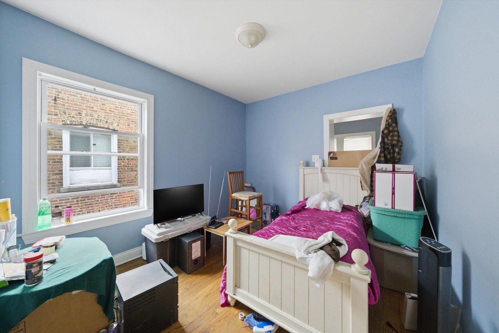 6837 South Morgan Street Chicago, IL 60621 - Photo 6 of 24 a bedroom with a bed and furniture