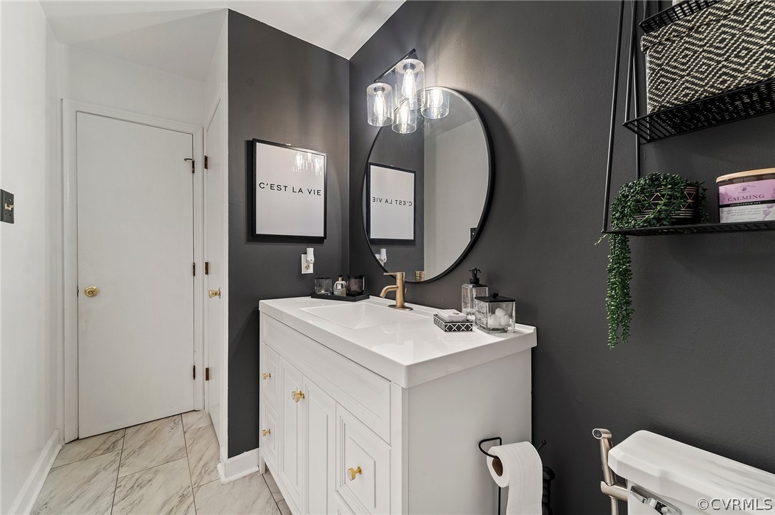 7731 Drexelbrook Road Chesterfield, VA 23832 - Photo 19 of 27 a bathroom with a toilet sink and mirror