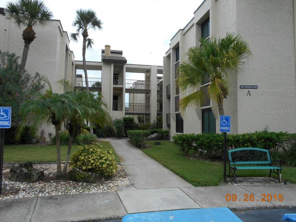 2205 Belleair Road, Unit A32 Clearwater, FL 33764 - Photo 1 of 1 a front view of a house with garden