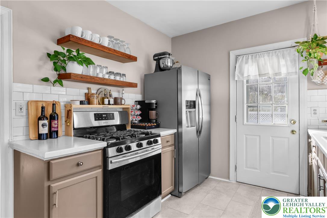 2145 Henderson Street Bethlehem, PA 18017 - Photo 12 of 42 a kitchen with stainless steel appliances granite countertop a refrigerator and a stove