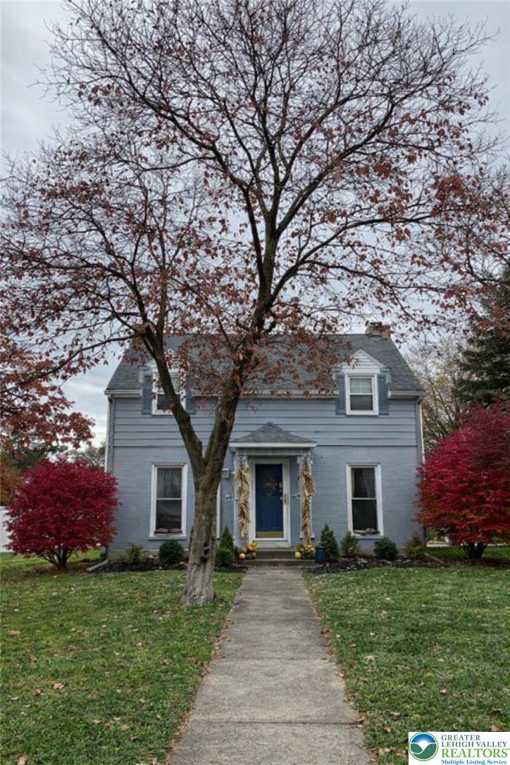 2145 Henderson Street Bethlehem, PA 18017 - Photo 34 of 42 a front view of a house with a garden and yard