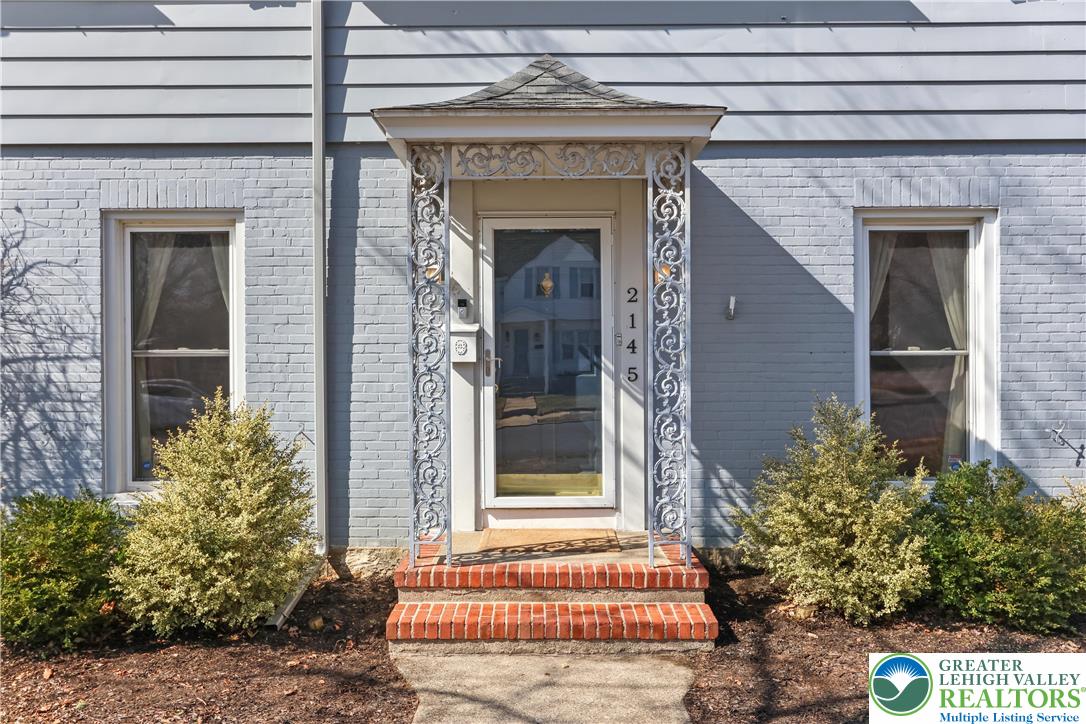 2145 Henderson Street Bethlehem, PA 18017 - Photo 6 of 42 a front view of a house with a garden