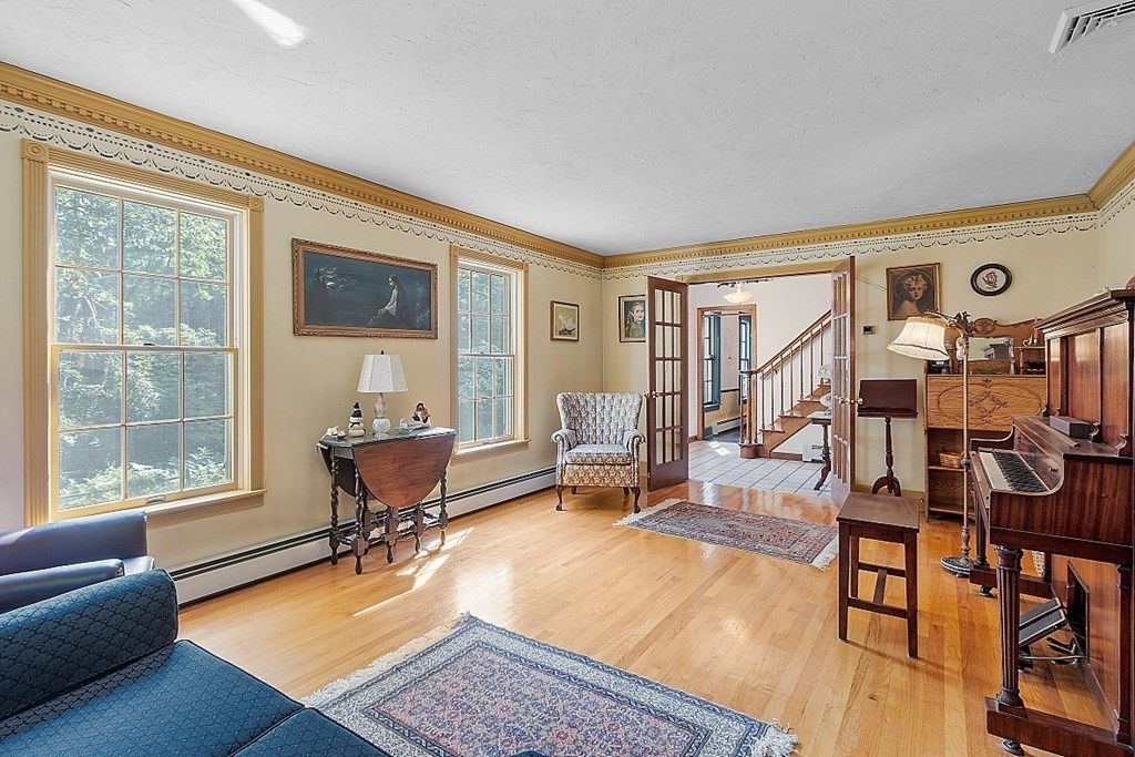 323 Knower Road Westminster, MA 01473 - Photo 6 of 42 a living room with furniture a rug and a window
