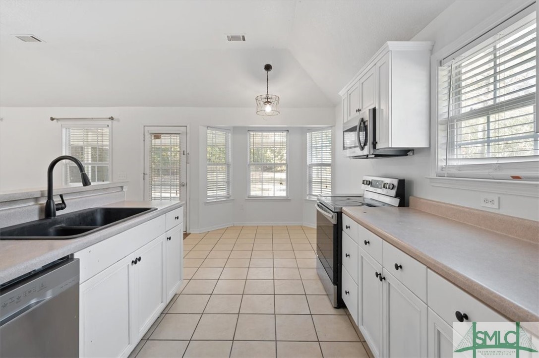 305 Elm Road Ellabell, GA 31308 - Photo 12 of 44 Tons of cabinetry and cabinet space.