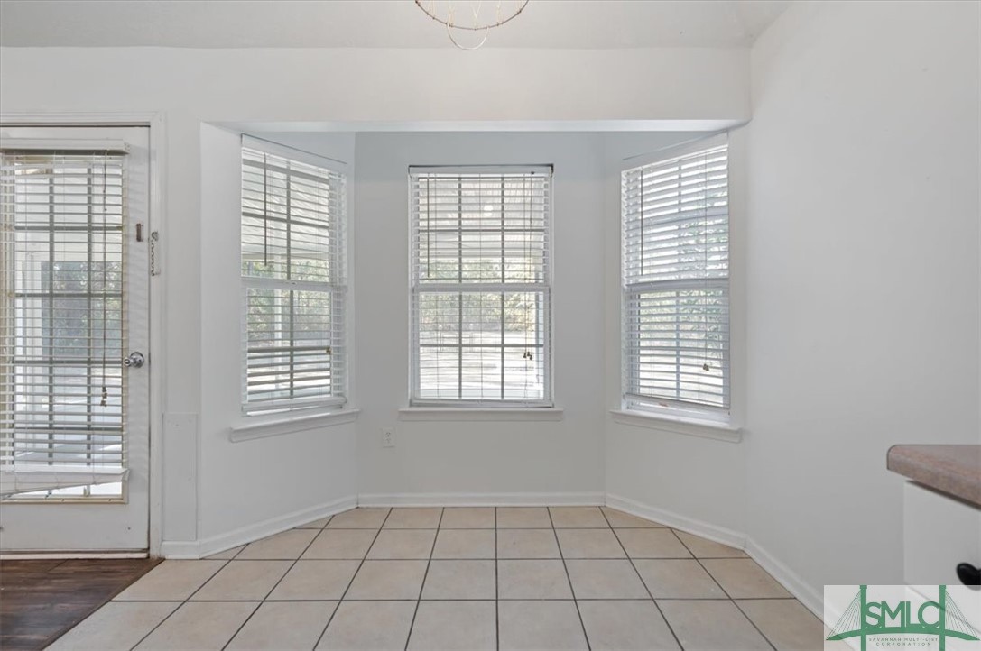 305 Elm Road Ellabell, GA 31308 - Photo 13 of 44 Dining area off the kitchen with beautiful picture