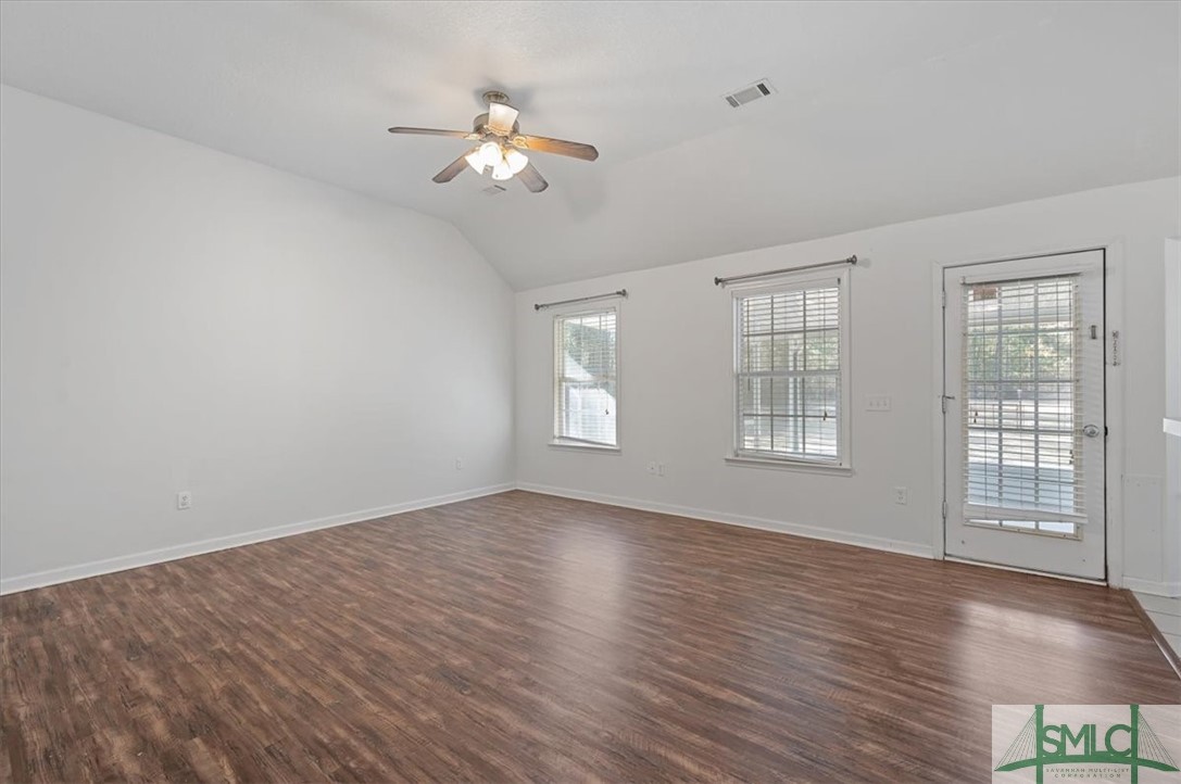 305 Elm Road Ellabell, GA 31308 - Photo 6 of 44 Great room with tall ceilings and ceiling fan.