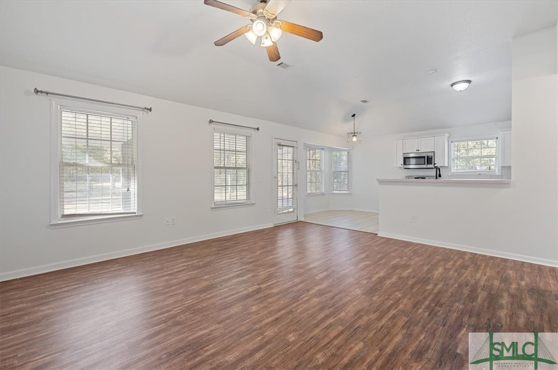 305 Elm Road Ellabell, GA 31308 - Photo 7 of 44 The great room opens to kitchen and dining.
