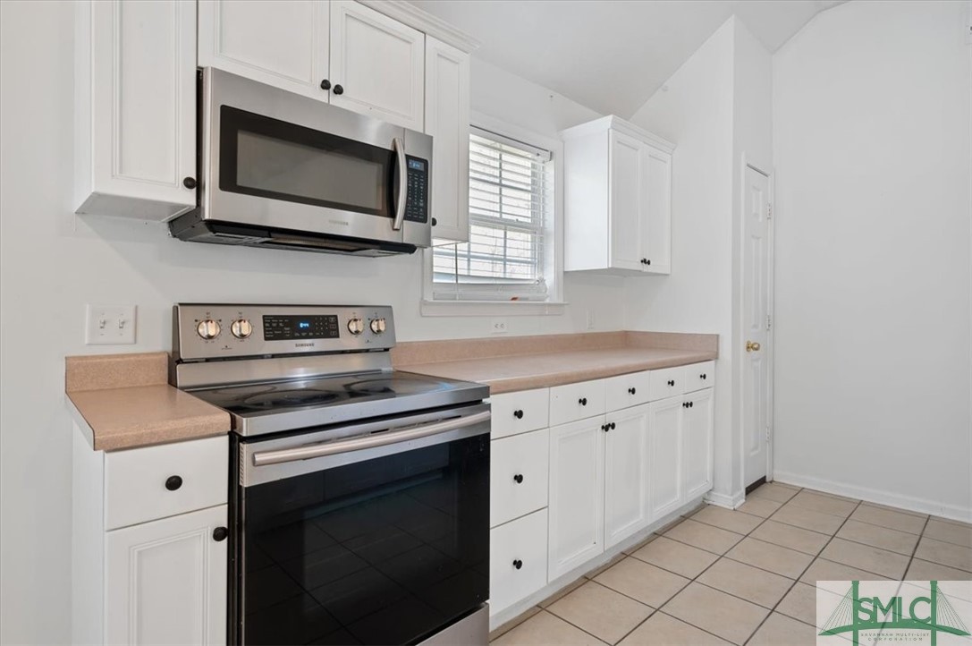 305 Elm Road Ellabell, GA 31308 - Photo 9 of 44 Stainless steel appliances and tile flooring.