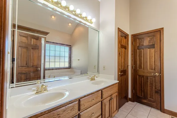 a bathroom with a sink double vanity and a mirror
