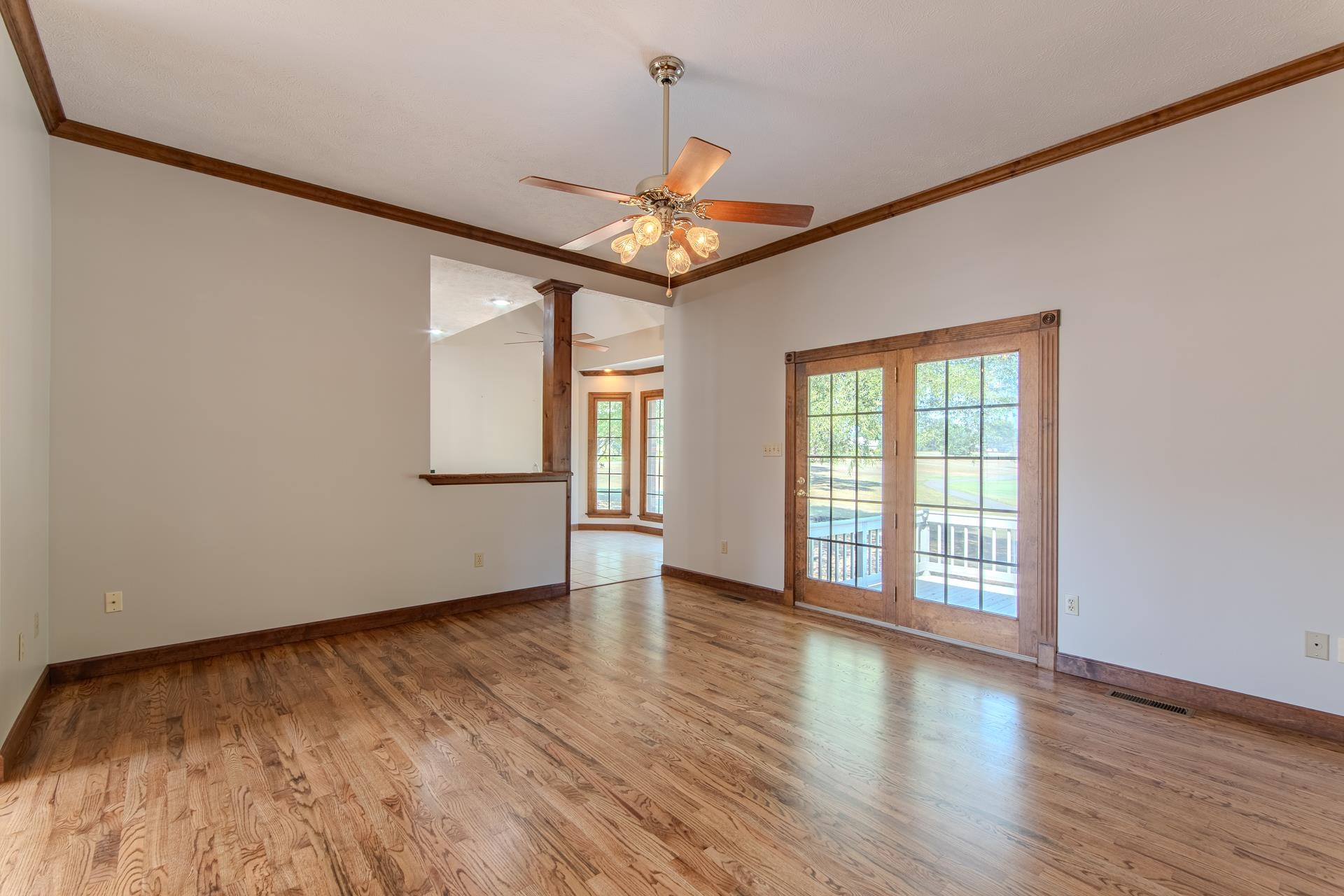 200 Grandview Circle Adamsville, TN 38310 - Photo 11 of 40 wooden floor in an empty room with a window