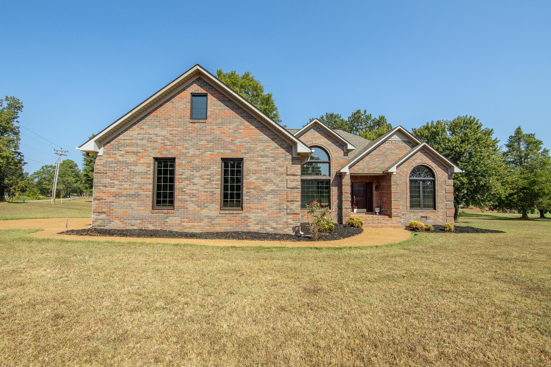 200 Grandview Circle Adamsville, TN 38310 - Photo 15 of 40 a front view of a house with a yard