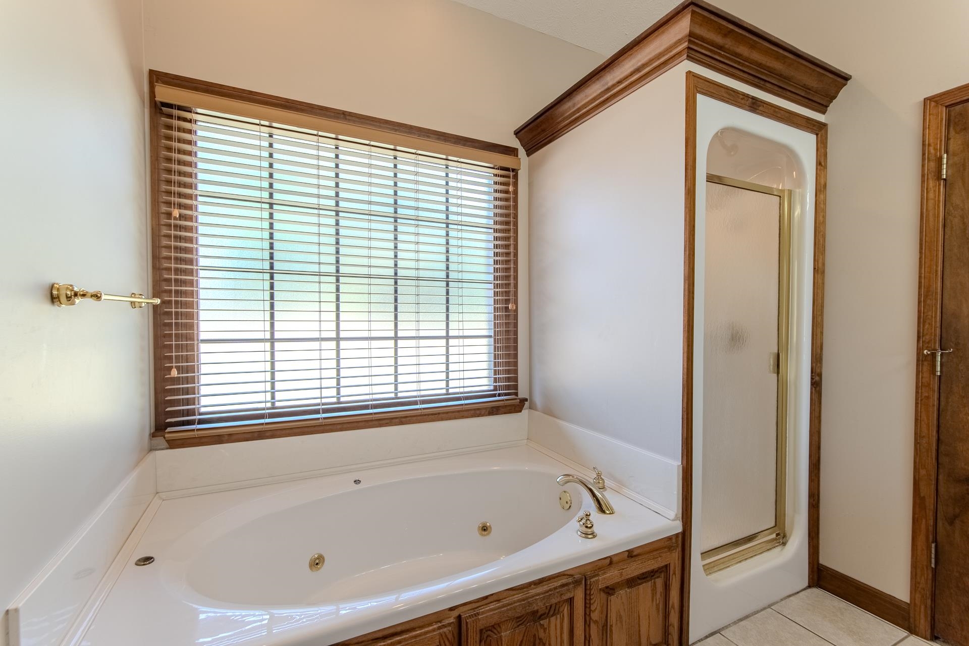 200 Grandview Circle Adamsville, TN 38310 - Photo 2 of 40 a bathroom with a bathtub and a shower