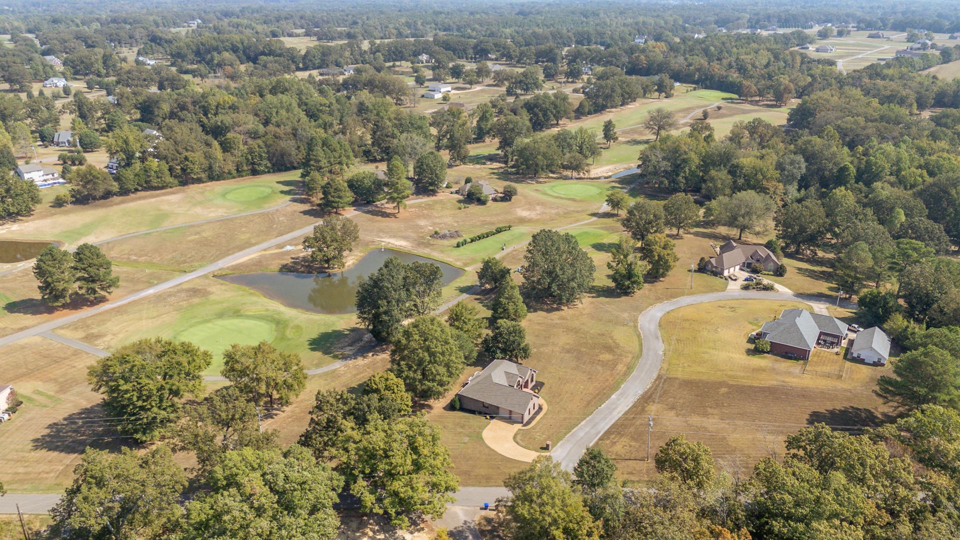 200 Grandview Circle Adamsville, TN 38310 - Photo 38 of 40 an aerial view of a house with a yard and lake view