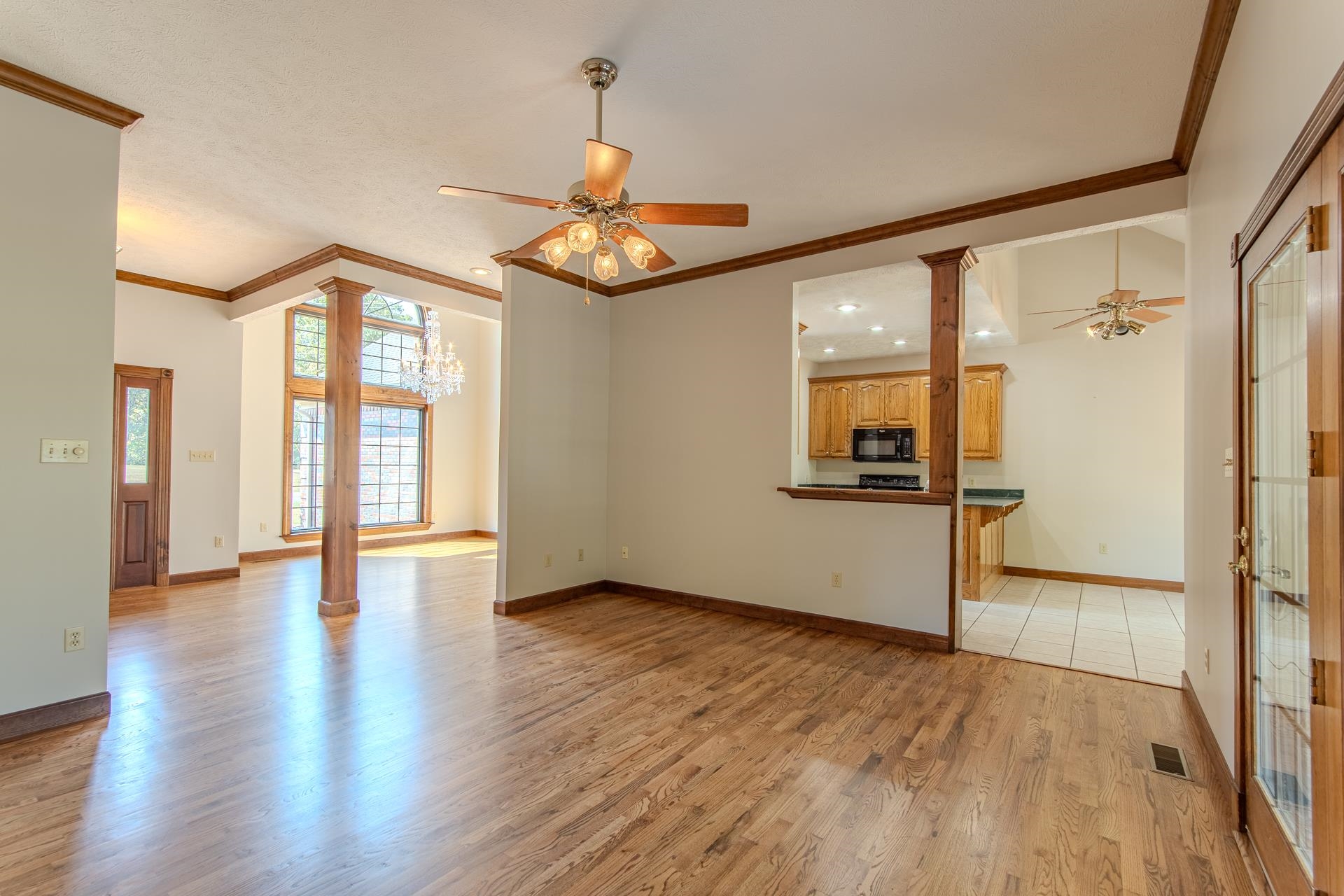 200 Grandview Circle Adamsville, TN 38310 - Photo 8 of 40 a view of an entryway with wooden floor and a hallway