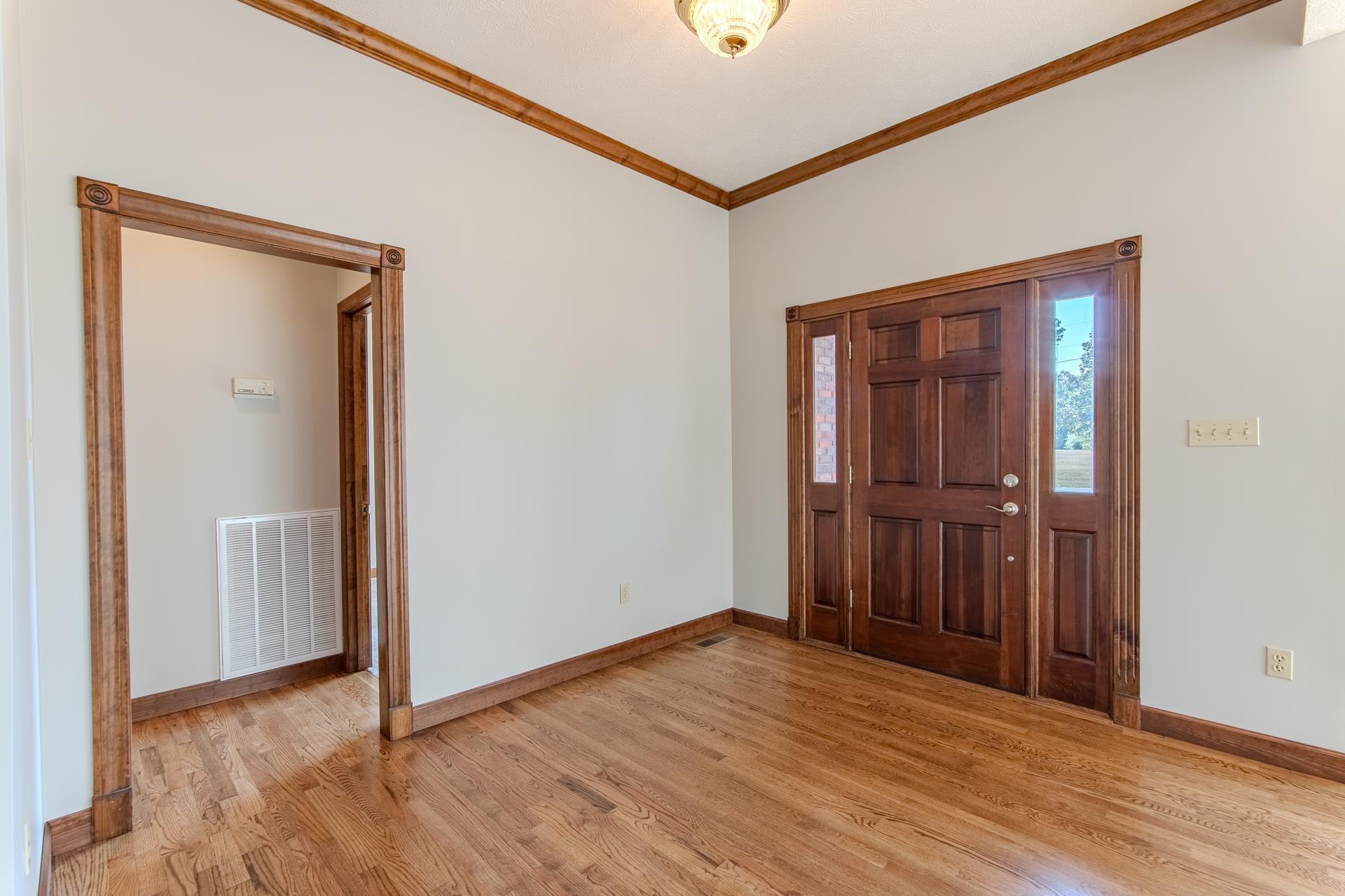 200 Grandview Circle Adamsville, TN 38310 - Photo 9 of 40 a view of empty room with wooden floor