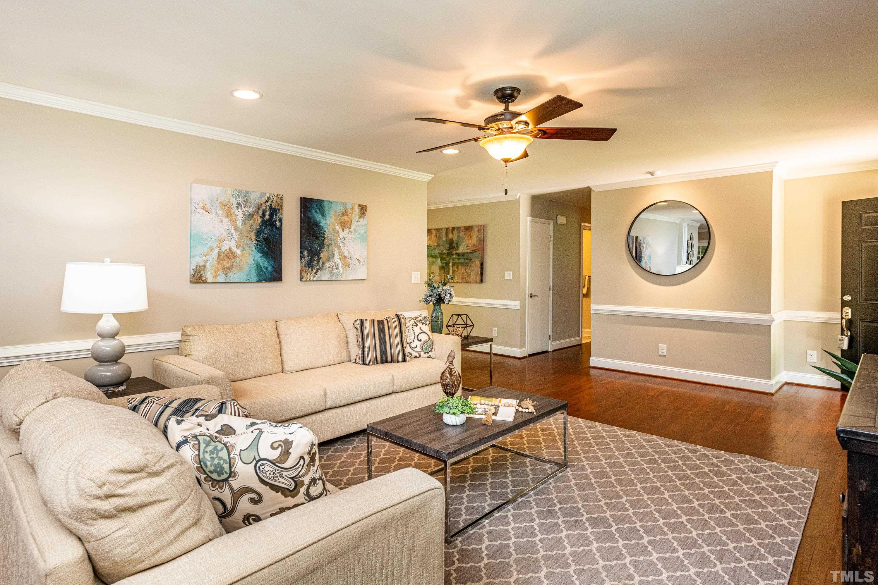 201 Chatterson Drive Raleigh, NC 27615 - Photo 13 of 44 a living room with furniture and a large window
