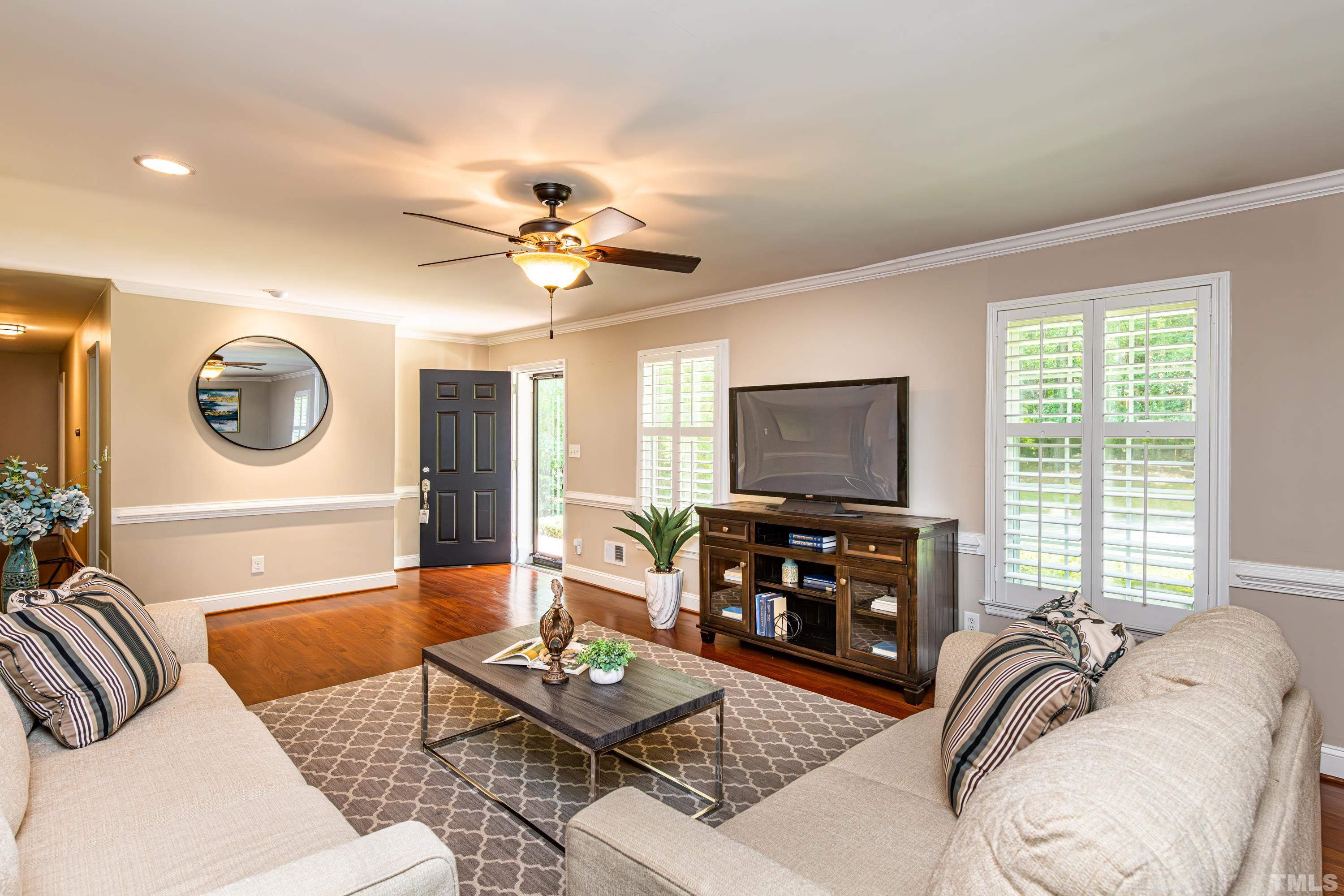201 Chatterson Drive Raleigh, NC 27615 - Photo 14 of 44 a living room with furniture and a flat screen tv