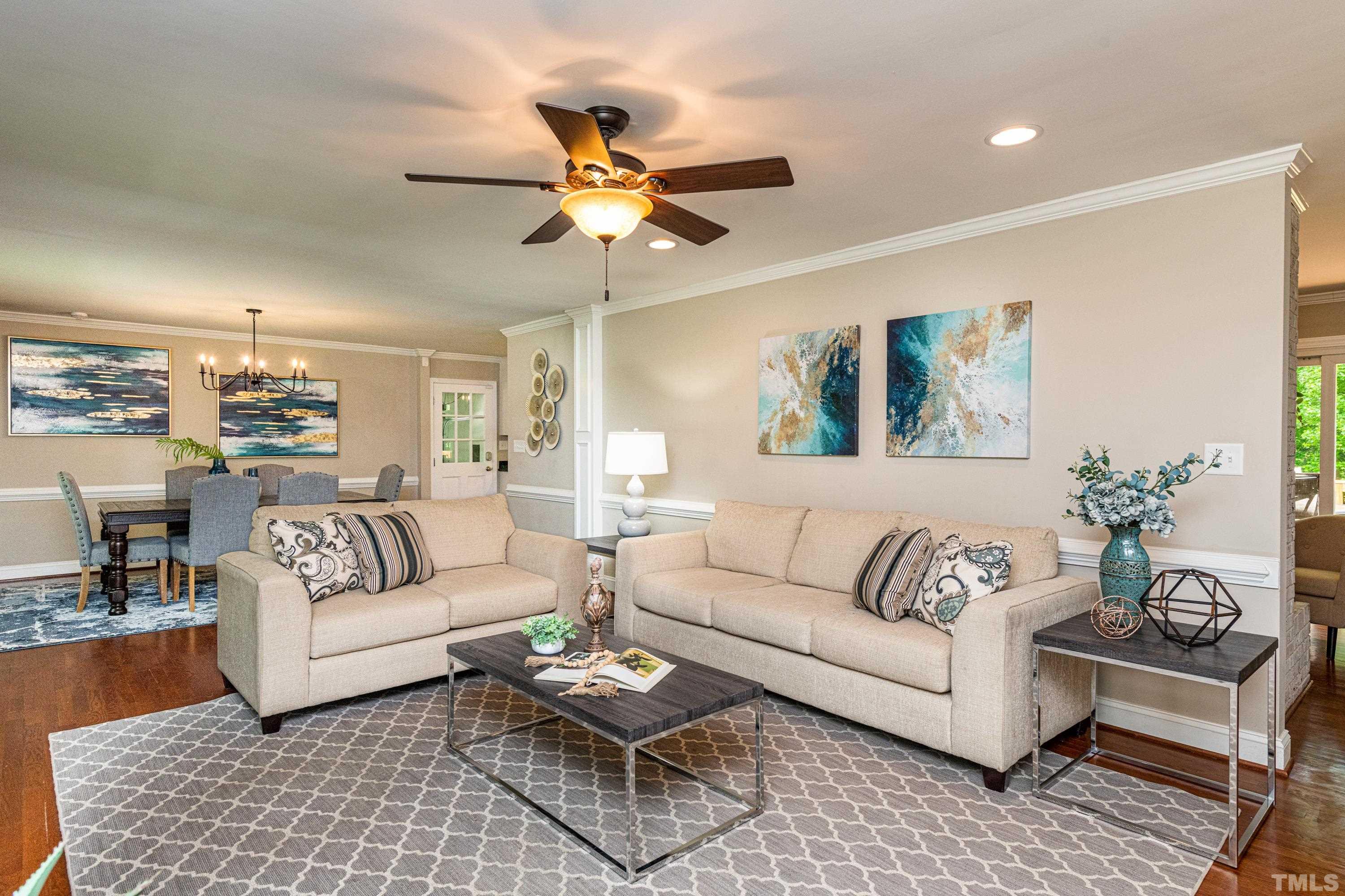 201 Chatterson Drive Raleigh, NC 27615 - Photo 15 of 44 a living room with furniture kitchen view and a rug