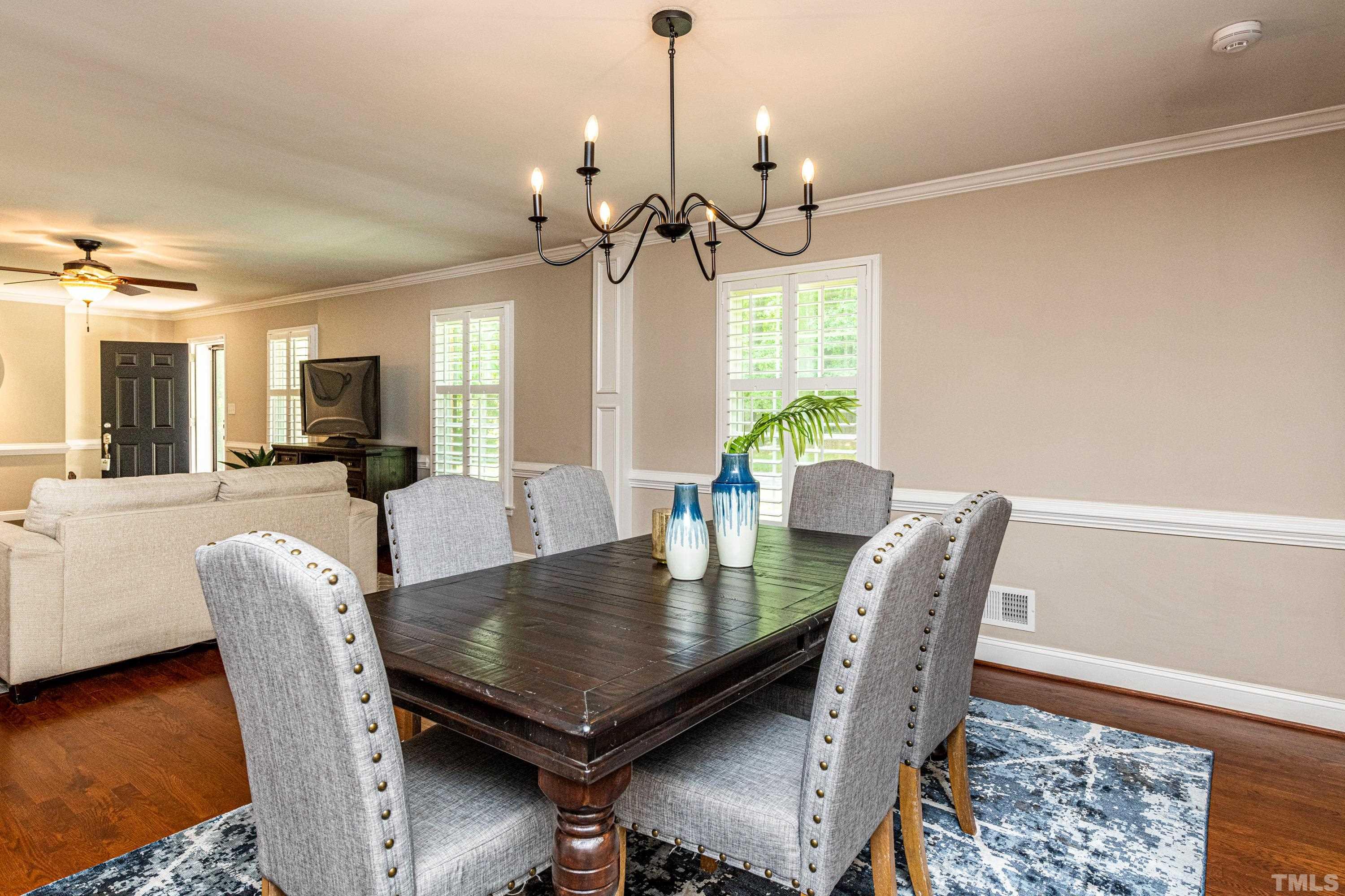 201 Chatterson Drive Raleigh, NC 27615 - Photo 17 of 44 a view of a dining room with furniture and window