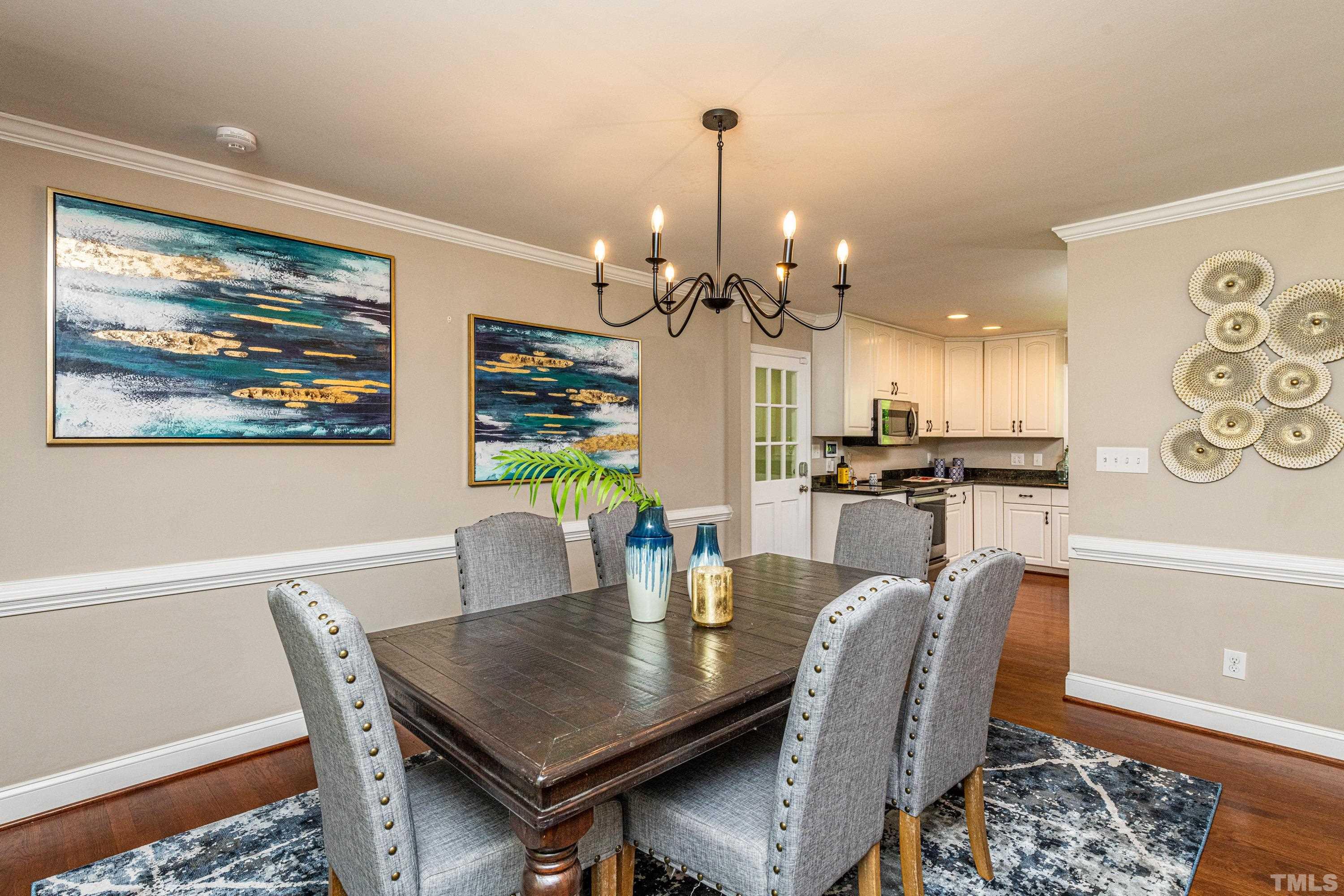 201 Chatterson Drive Raleigh, NC 27615 - Photo 18 of 44 a view of a dining room with furniture and wooden floor