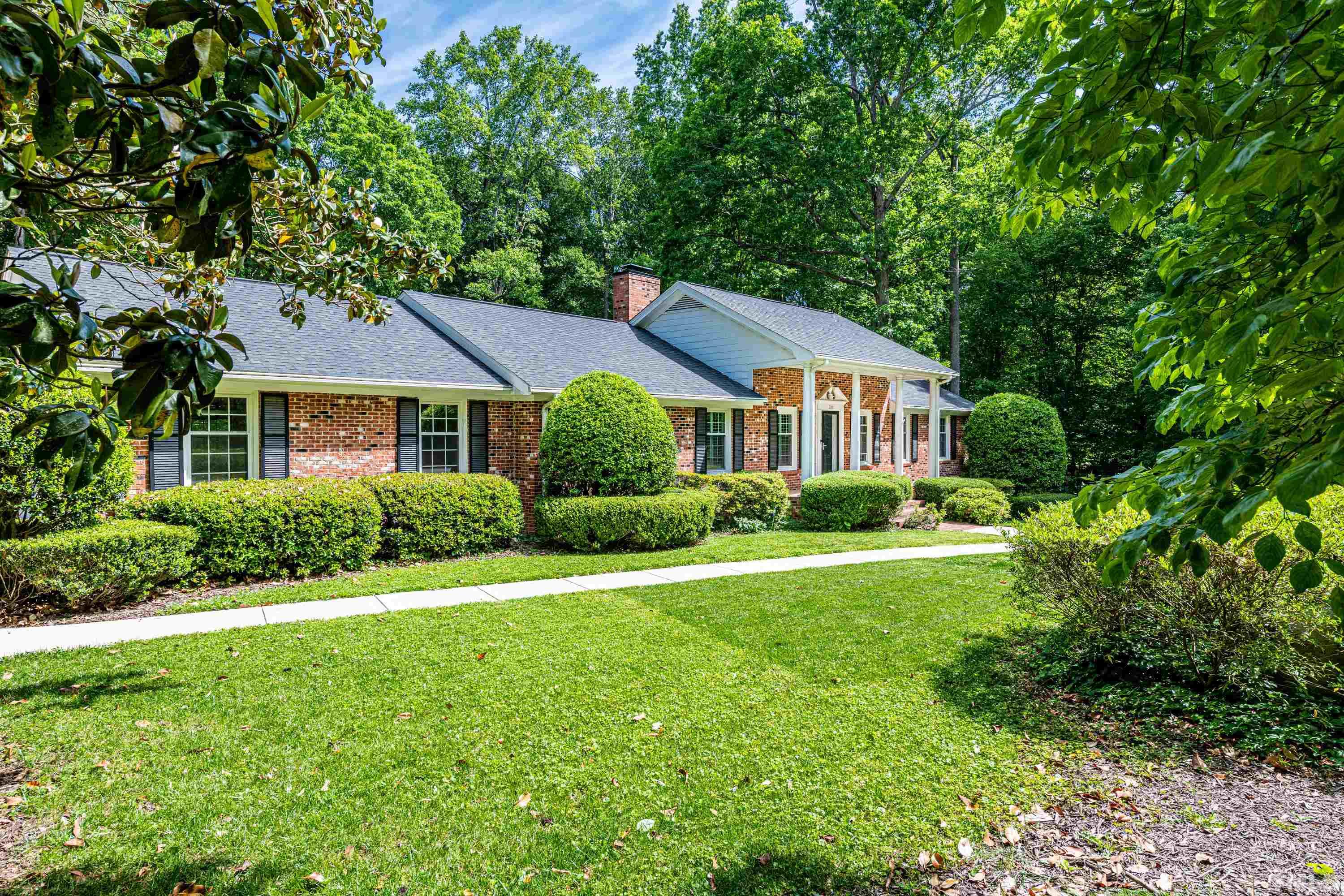 201 Chatterson Drive Raleigh, NC 27615 - Photo 2 of 44 a front view of a house with a yard