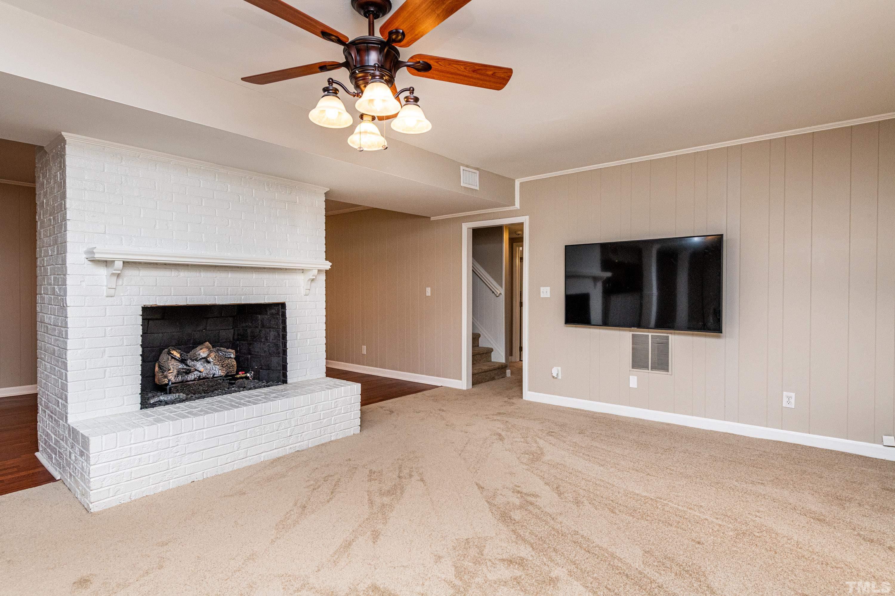 201 Chatterson Drive Raleigh, NC 27615 - Photo 27 of 44 a view of a livingroom with a fireplace