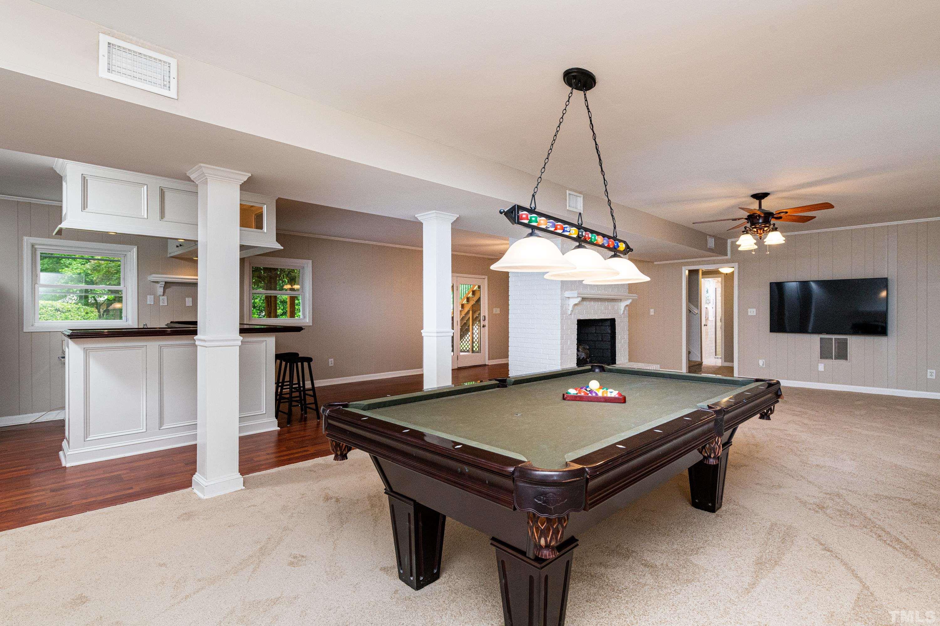 201 Chatterson Drive Raleigh, NC 27615 - Photo 29 of 44 a living room with pool table and flat screen tv